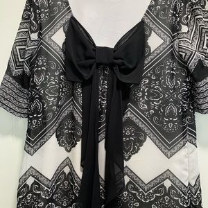 Dress with large bow on back